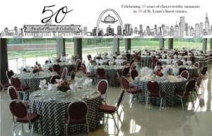 A banquet hall with round tables covered in checkered tablecloths, set with dinnerware and floral centerpieces. The backdrop features illustrations of a city skyline and text celebrating 50 years of venues in St. Louis.