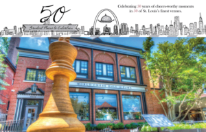 Illustration celebrating 50 years of entertainment in St. Louis venues. Features a brick building labeled "World Chess Hall of Fame" with a large chess piece sculpture in front. A city skyline and celebratory text are at the top.
