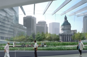 People walking on a pedestrian bridge with a view of a park and a historic domed building in a city skyline background, featuring tall modern skyscrapers. The sky is clear and the setting appears urban and lively.