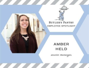Image of a woman smiling, wearing a brown cardigan and necklace, featured in an employee spotlight for "Butler's Pantry." Text next to her reads "Amber Held, Service Manager" with a logo of a person holding a tray above.