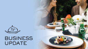A sophisticated table setting with a gourmet dish on a dark plate, surrounded by flowers, sparkling water, and elegantly dressed individuals in conversation. Text overlay reads "Business Update" with a logo above it.