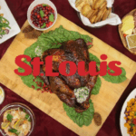 A table with assorted dishes and a roasted turkey, overlaid with the word "StLouis" in bold red letters.